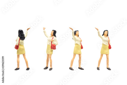 Miniature figurine character as passenger standing and posing in posture isolated on white background.