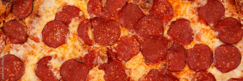 Piperoni pizza texture. Macro. Background of pizza toppings. Piperoni pizza texture. Macro. Background of pizza toppings.