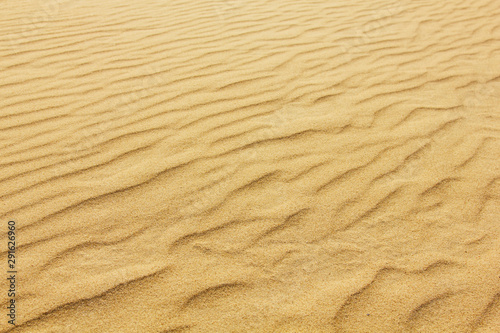 closeup of sand pattern of a beach