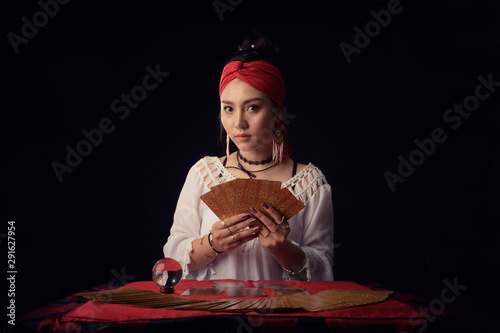 Tarot cards reading woman predicting future