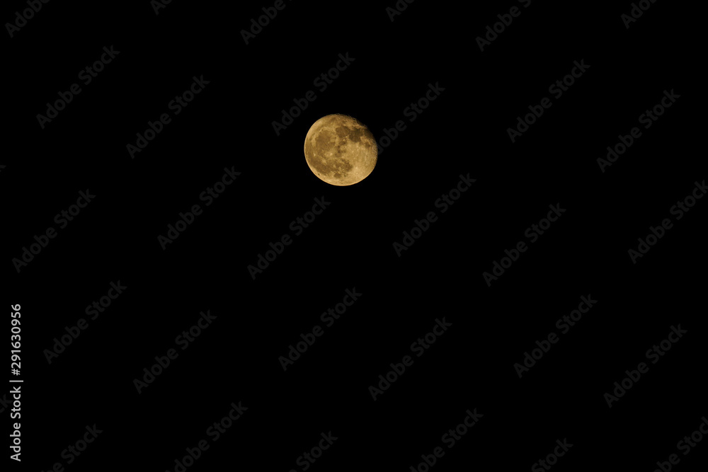 A red yellow moon on a clear night. A red yellow moon on a clear night.