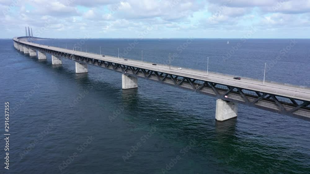 Forward aerial towards and above long curved bridge in Scandinavia Forward aerial towards and above long curved bridge in Scandinavia