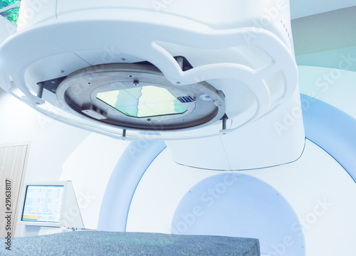X-ray machine in the room at radiology department in the hospital.Computed tomography scan machine in room.Radiotherapy medical equipment. photo