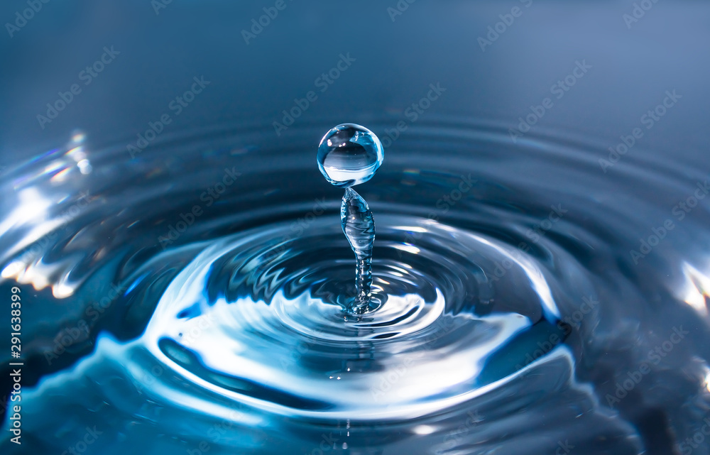 Water splash or drop. Water splash close-up. Blue water drop. Falling water Water splash or drop. Water splash close-up. Blue water drop. Falling water