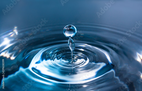 Water splash or drop. Water splash close-up. Blue water drop. Falling water