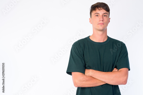 Portrait of young handsome man with arms crossed © Ranta Images