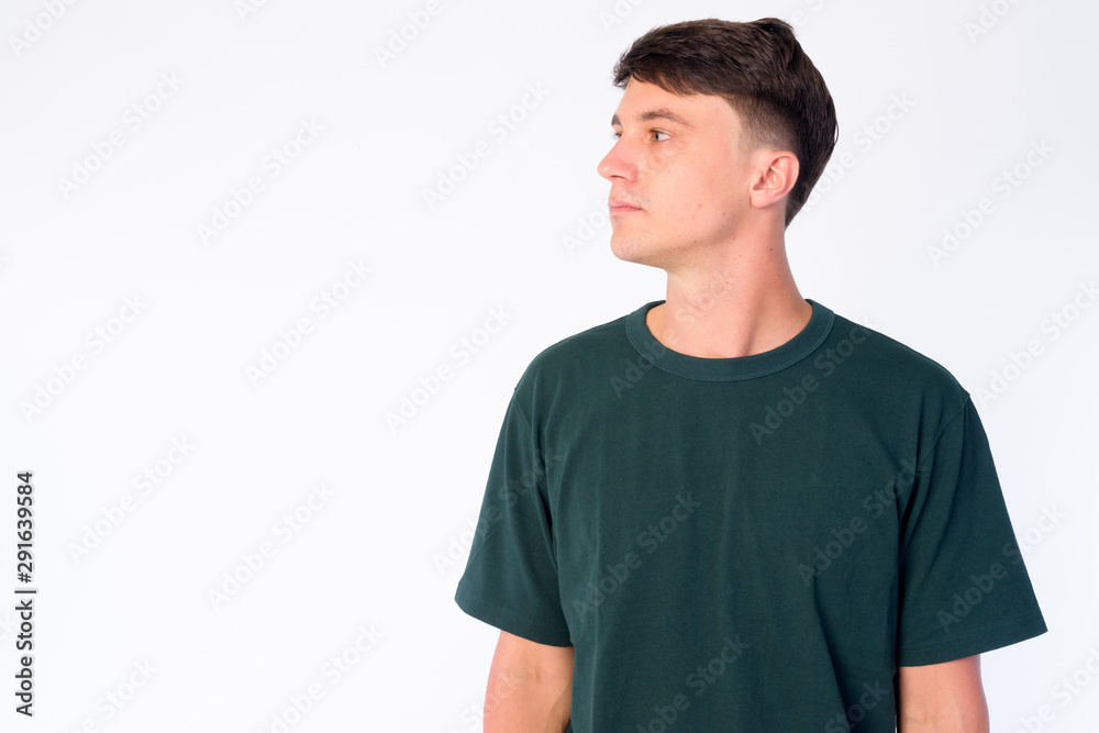 Portrait of young handsome man thinking and looking up Portrait of young handsome man thinking and looking up