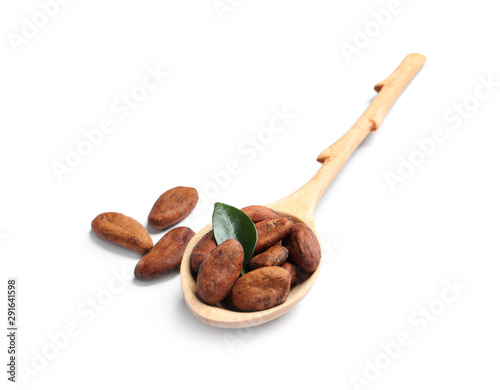 Wooden spoon with cocoa beans and leaf isolated on white