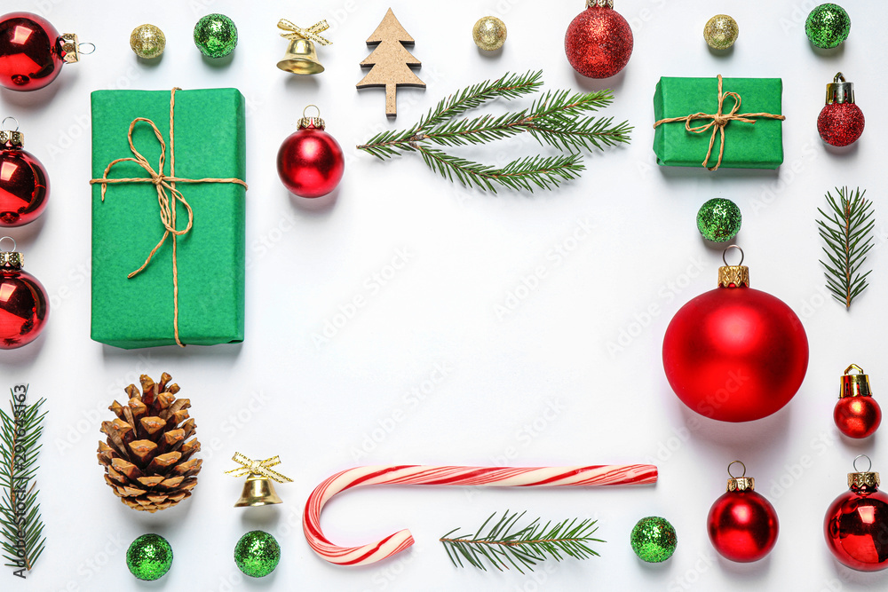 Frame of Christmas tree branches and festive decoration on white background, top view. Space for text - obrazy, fototapety, plakaty 