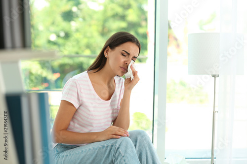 Young woman suffering from allergy at home Free Download Young woman suffering from allergy at home - GFXLoad
