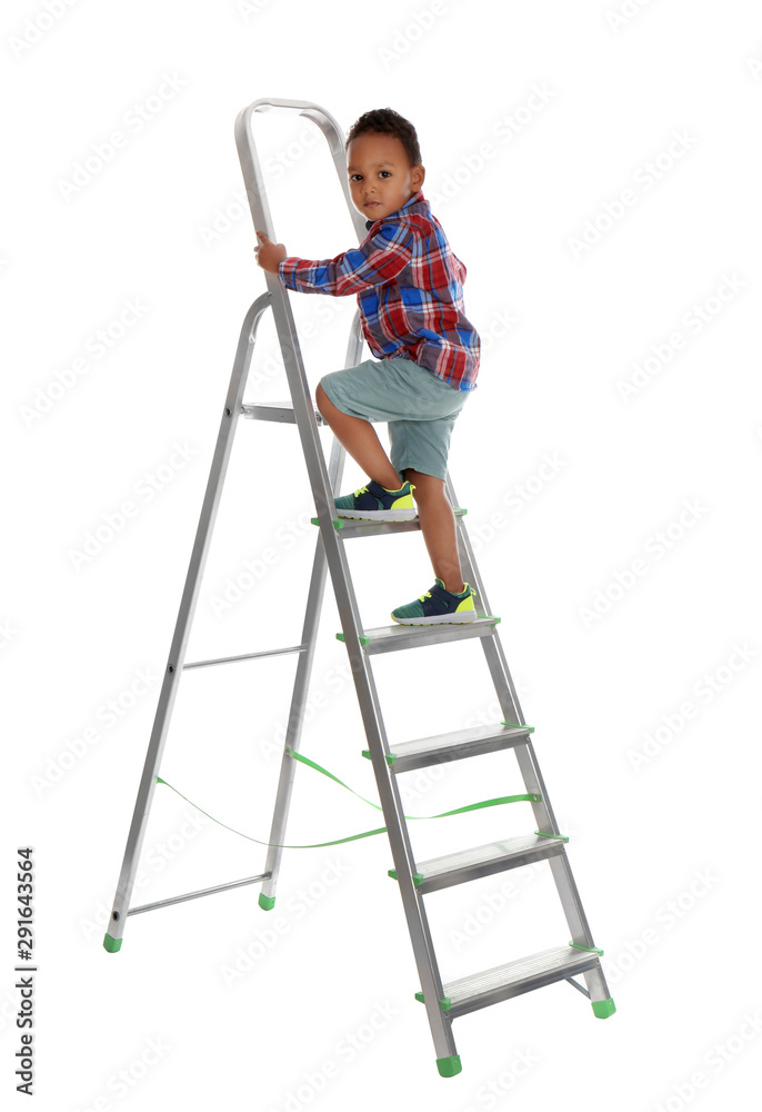 Little African-American boy climbing up ladder on white background. Danger at home Little African-American boy climbing up ladder on white background. Danger at home
