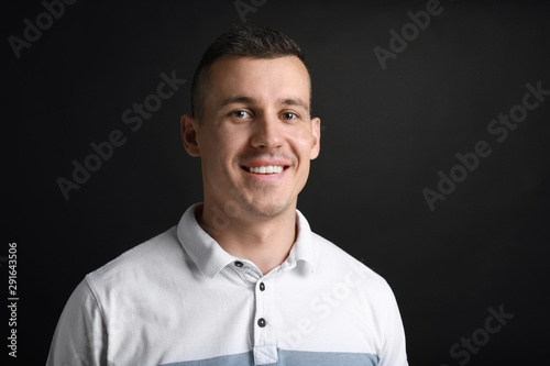 Portrait of handsome man on black background