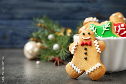 Tasty homemade Christmas cookies on grey table, closeup view. Space for text