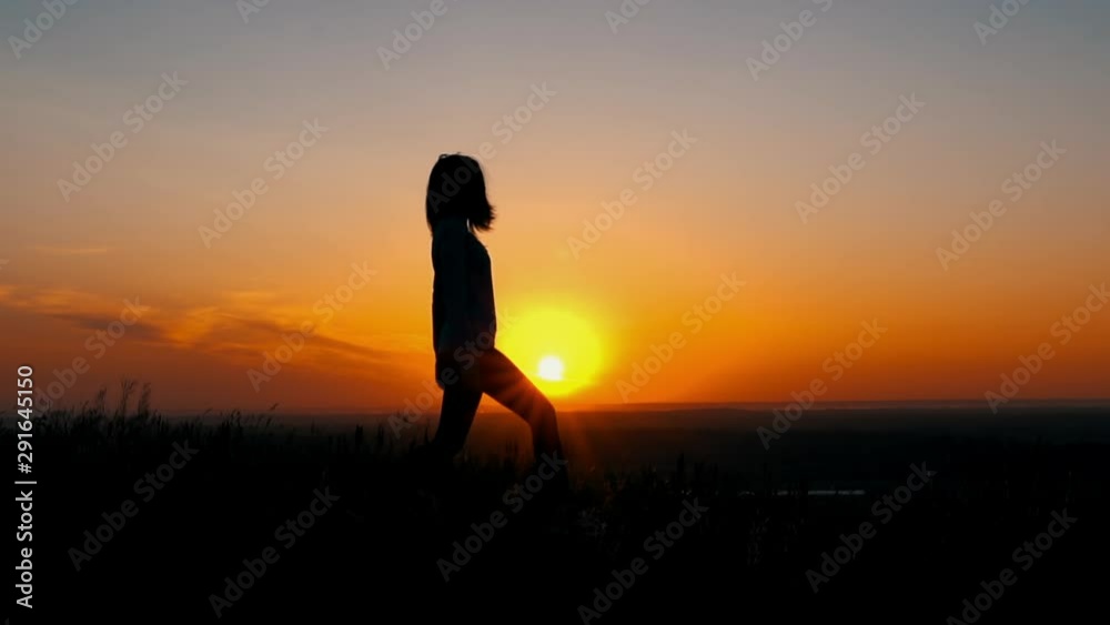 side view silhouette of sport woman at sunrise yoga exercises outdoors beautiful view on sky with rising sun side view silhouette of sport woman at sunrise yoga exercises outdoors beautiful view on sky with rising sun