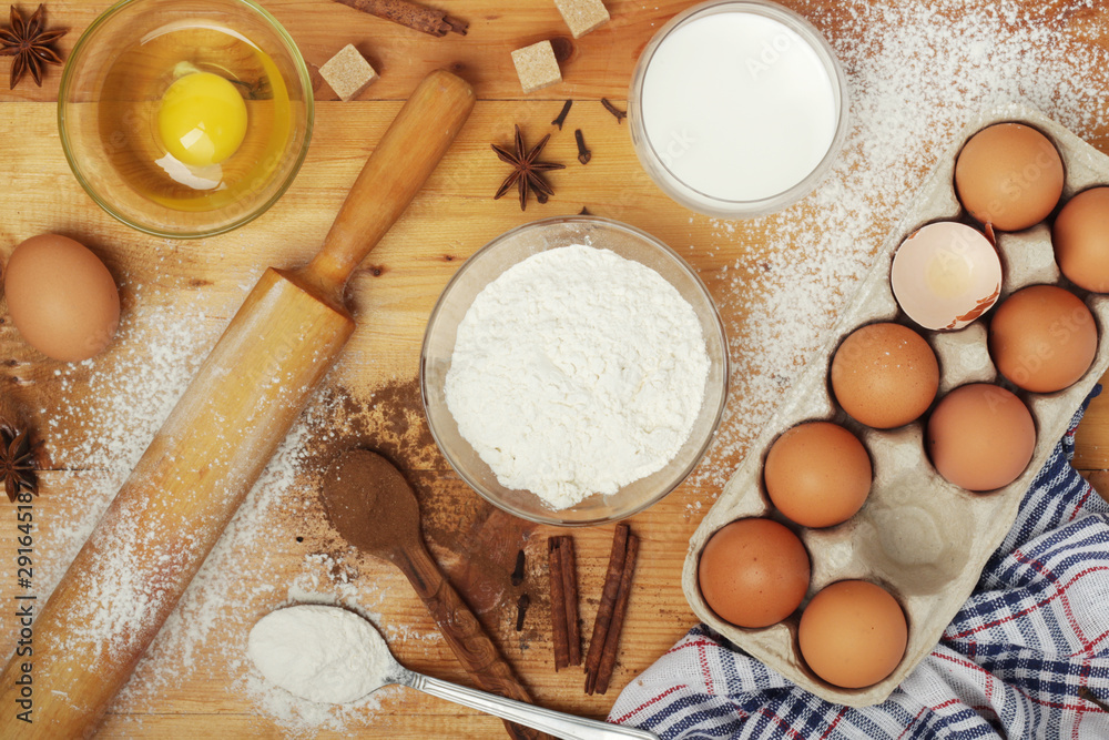 Food ingredients for baking: flour, eggs, milk, sugar Food ingredients for baking: flour, eggs, milk, sugar