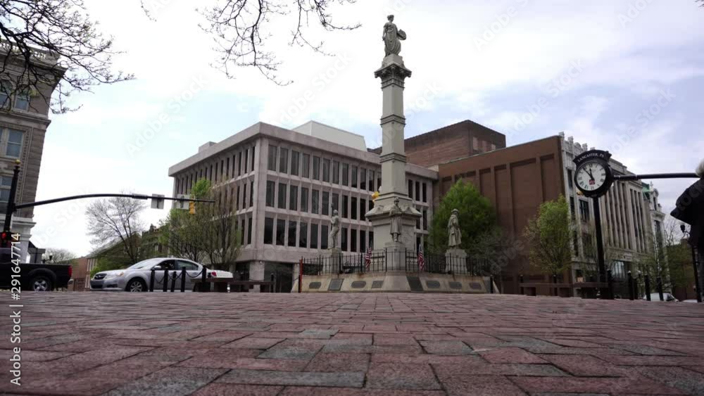 Low angle dolly view of statue in downtown Lancaster PA