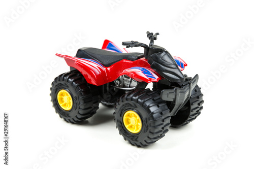 Red toy plastic quad atv on a white background