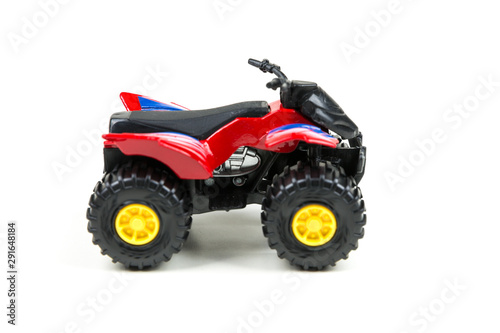 Red toy plastic quad atv on a white background