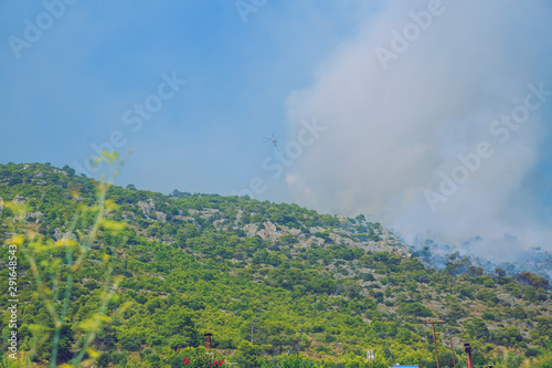 City Moni Osiou Patapiou, Greek Republic. Mountains and fire smoke. 14. Sep. 2019 photo