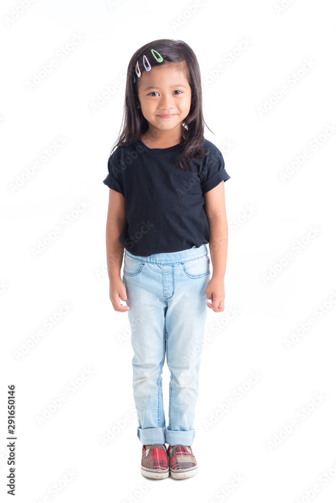 Fototapeta premium Full length of Little asian girl standing and smiling isolated over white background