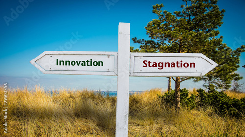 Street Sign Innovation versus Stagnation photo