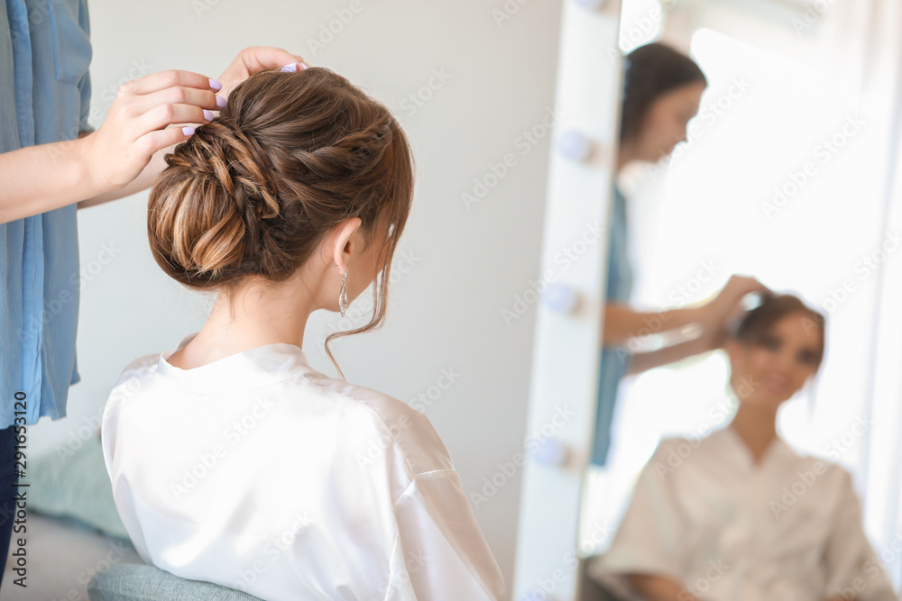 Professional hairdresser working with young bride at home Professional hairdresser working with young bride at home