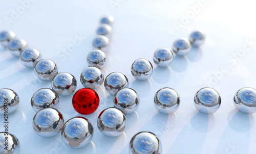 Obraz na płótnie Concept or conceptual collection of balls in form of a circle with a red one standing out on blue background as a metaphor for creativity and leadership