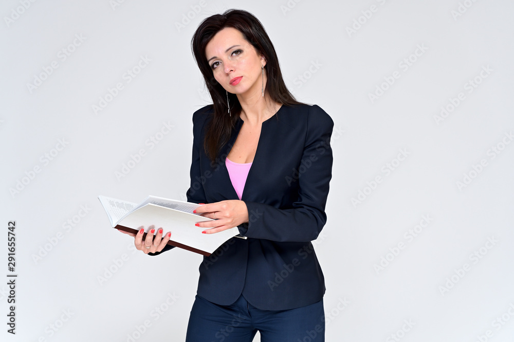 Portrait of a brunette manager woman in a business suit on a white background with a folder in her hands. Great makeup and beautiful hair. Standing right in front of the camera in various poses. Portrait of a brunette manager woman in a business suit on a white background with a folder in her hands. Great makeup and beautiful hair. Standing right in front of the camera in various poses.