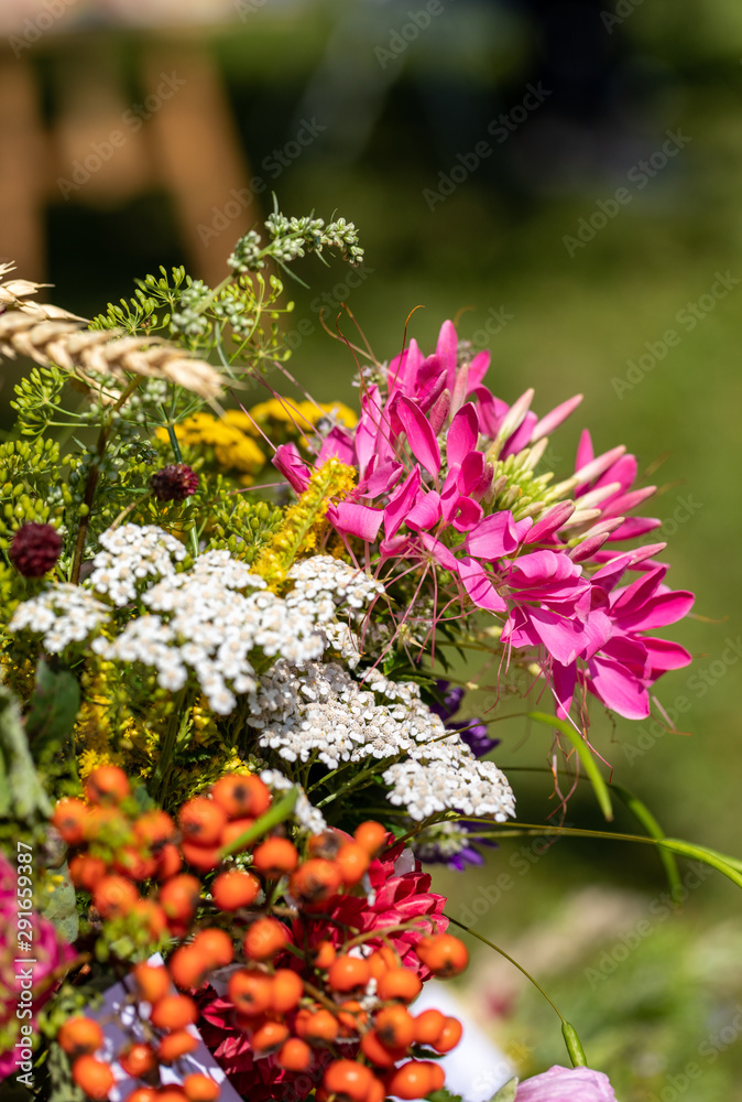 Obraz premium Floristic bouquet of flowers, herbs and fruits that are the symbol of summer