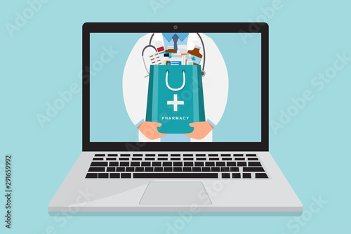 Online pharmacy. doctor with medicine bag inside laptop