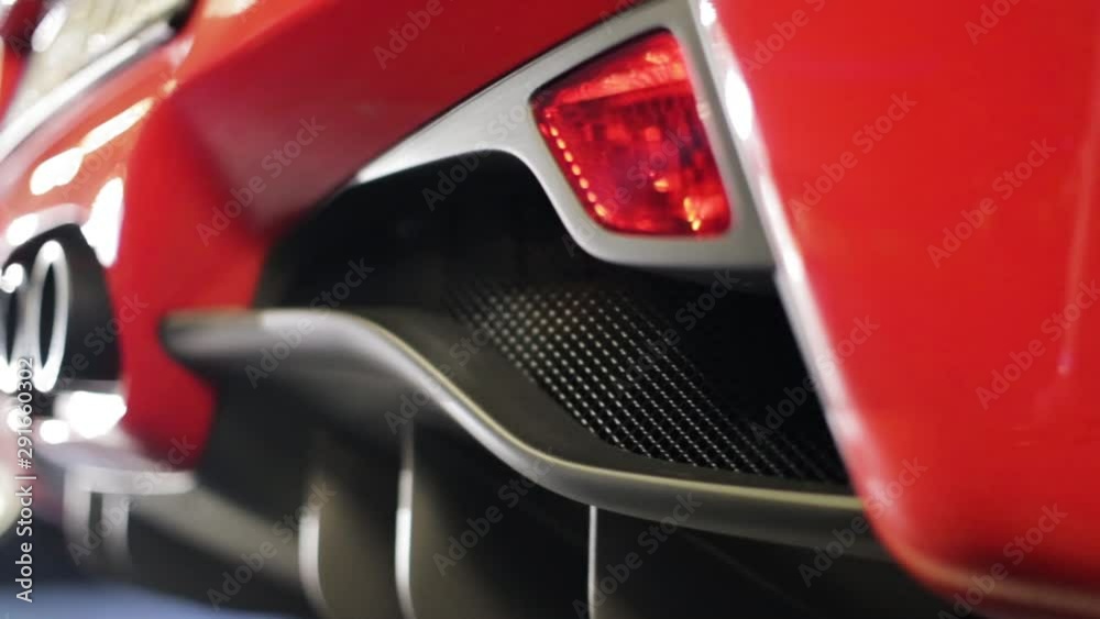Red car modern design three exhaustion pipes Red car modern design three exhaustion pipes