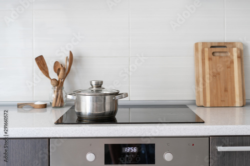Kitchen with built in ceramic induction stove photo