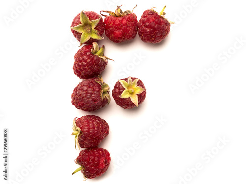 Isolated alphabet letter lined with fresh raspberries