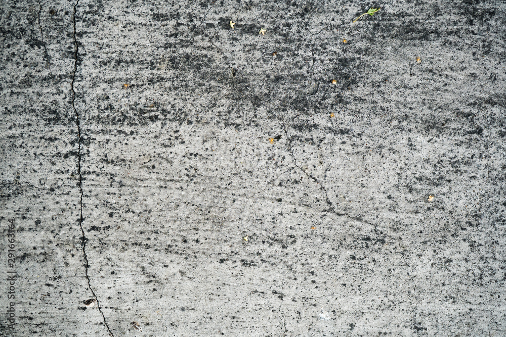 Obraz premium Texture of an old cracked concrete wall. Background image of a worn gray concrete surface