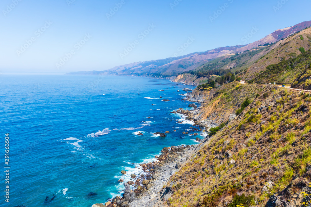 View of the spectacular coast-hugging California’s Highway 1 on a summer day View of the spectacular coast-hugging California’s Highway 1 on a summer day