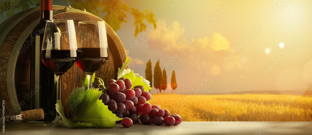 autumn countryside wine background; vine, red wine bottles, wineglass, wine barrel; wine tasting concept - obrazy, fototapety, plakaty 
