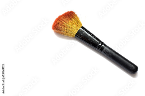 cosmetic brush for applying powder on a white background