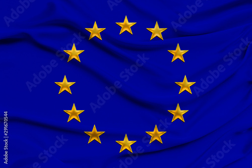 stylized European Union flag, symbol of united Europe on soft silk with soft folds, close-up