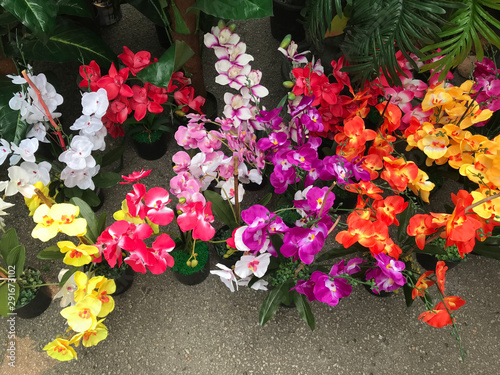 Colorful artificial flowers made from plastic displays in stores for sale
