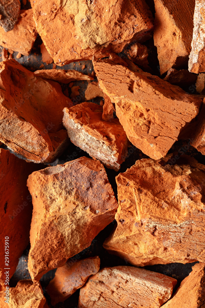 Texture of broken clay brick close up. Top view. Texture of broken clay brick close up. Top view.