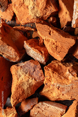 Texture of broken clay brick close up. Top view.