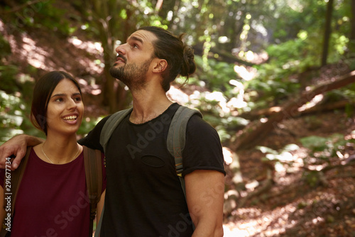 Young couple talking and laughing as they walk