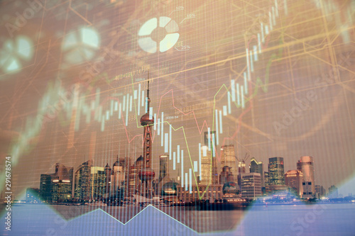 Fotografie Forex chart on cityscape with tall buildings background multi exposure