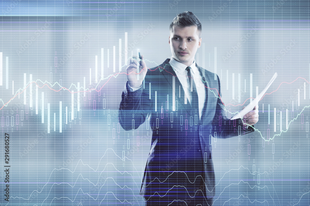 Businessman and forex graph hologram. Double exposure. Concept of financial education and analysis Businessman and forex graph hologram. Double exposure. Concept of financial education and analysis