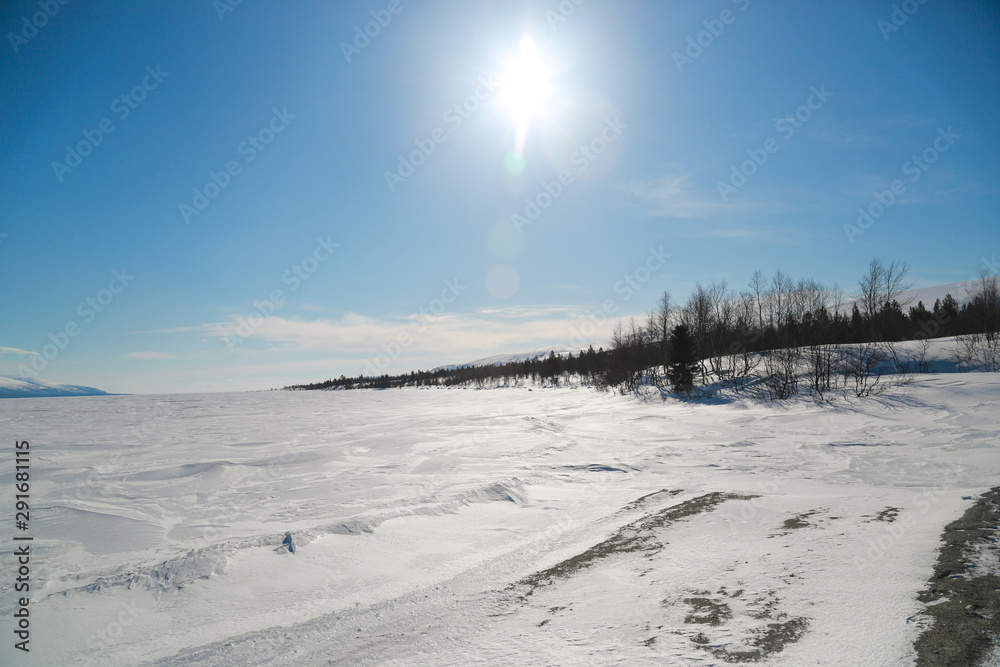 winter mountain landscape with frozen lake and blue sky winter mountain landscape with frozen lake and blue sky