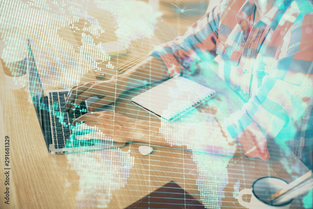 Multi exposure of businessman working on laptop on background. International business hologram in front. Concept of success. Multi exposure of businessman working on laptop on background. International business hologram in front. Concept of success.