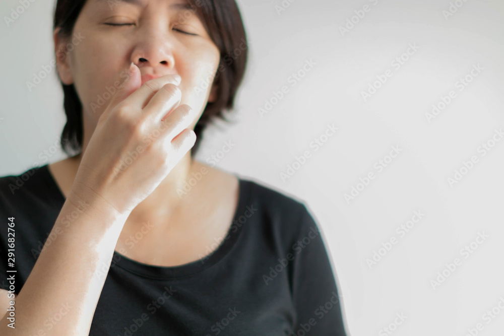 A woman portrait blowing nose before sneeze. A woman portrait blowing nose before sneeze.