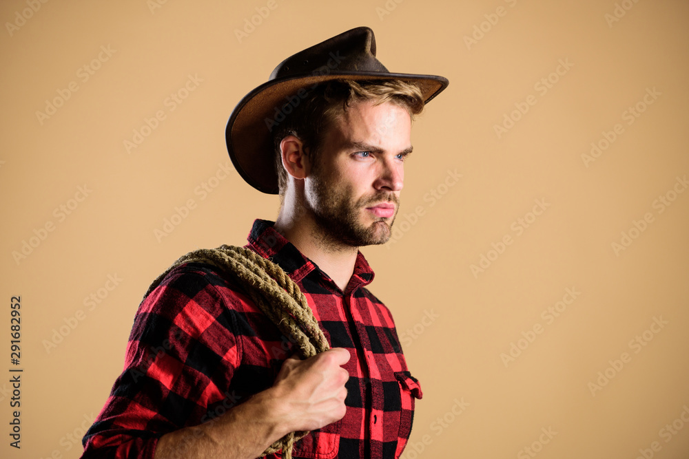 ready to ride. man checkered shirt on ranch. wild west rodeo. man in hat. western cowboy portrait. cowboy with lasso rope. Western. Vintage style man. Wild West retro cowboy ready to ride. man checkered shirt on ranch. wild west rodeo. man in hat. western cowboy portrait. cowboy with lasso rope. Western. Vintage style man. Wild West retro cowboy