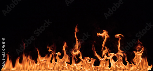 Texture of fire wall isolated on a black background.