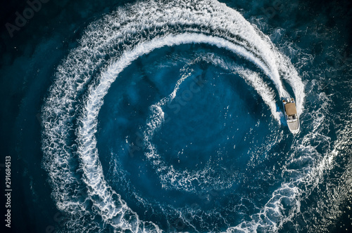 Speed boat in mediterranean sea making a cyrcle from bubbles, aerial view © Lukas Gojda